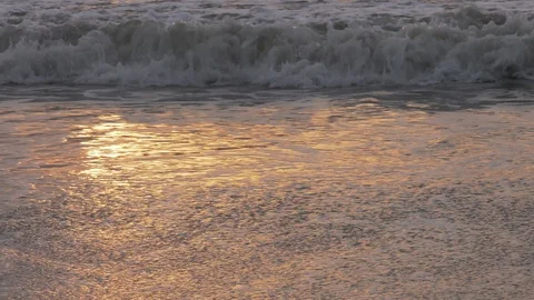 Waves lapping in shallow water at sunrise Stock Footage 93408071