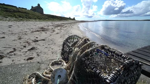 Waves lapping on the shore on Copensay in Orkney in 4k  Video stock 298345685