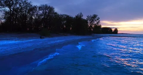 Waves Lapping At Shore Lake Drone Jib Sunrise Great Lakes Aerial 4K Nature Stock Footage 347919054