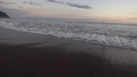 Waves Licking The Shore of Black Sand Beach Close up Slow Motion Stock Footage 87723853