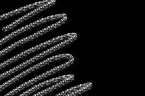 Waves of lines made on the side of the frame with a computer brush on a bla.. Stock Illustration