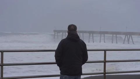 Waves a man from behind 스톡 동영상 112954355