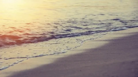 Waves on a Mediterranean beach in the sunset Видео 78557054