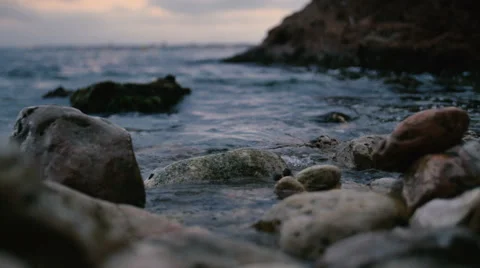 The waves of the mediterranean sea are rolled on a rocks Stock Footage 64890748