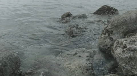 Waves of Mediterranean sea beating against the rocks Stock Footage 41790641