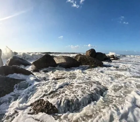 Waves of the Mediterranean Sea crash onto rocks along the Sicilian coast Stock Footage 332847538