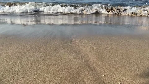 Waves of Mediterranean Sea rolling in sunshine to the sandy beach. Beautiful Cyp Stock-Footage 224849733