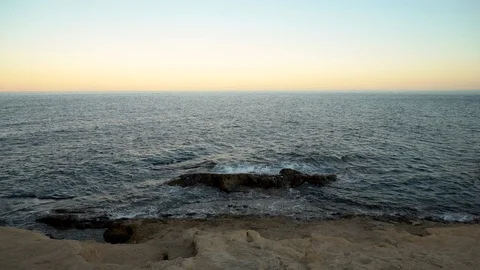 Waves on the Mediterranean Sea. The waves hit the rocks. Stock Footage 120081289