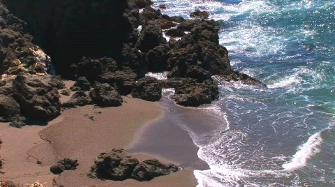 Waves meet rocky shore Stock Footage 419793