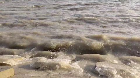 Waves of Meghna River Breaking Against Concrete Riverbank in Bangladesh Stock Footage 342876708