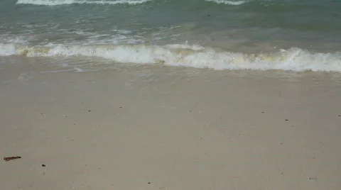 Waves mixing beach sand Stock Footage 664316