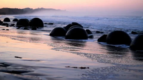 Waves on Moeraki boulders Stock Footage 35659199