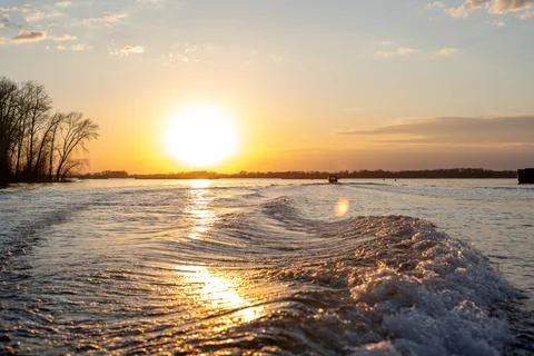 Waves from the motor on the river Stock Photos