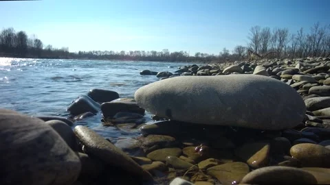The waves of the mountain river beat against the stones in the rays . Stock Footage 237709631