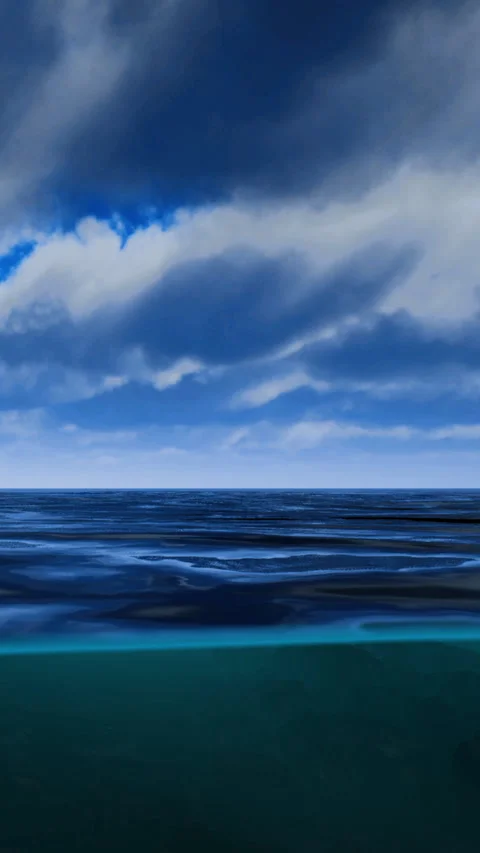 Waves move across the ocean under clouds with shifting skies at midday Stock Footage 335236027