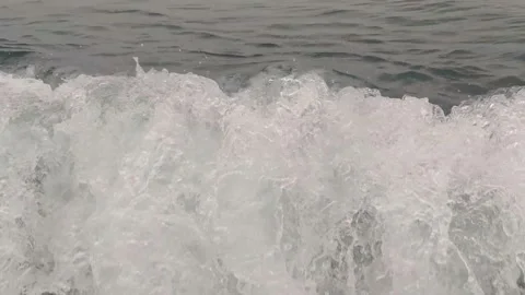  As the waves move, they create a texture of white sea foam. Calabria beach. Stock Footage 197143381
