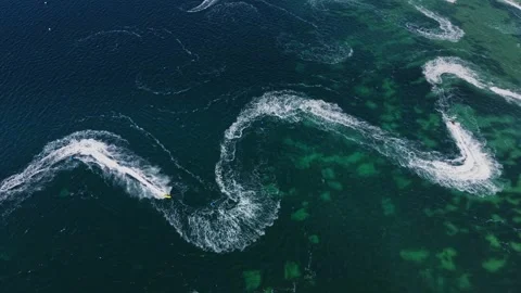 Waves move in a winding pattern over a deep blue ocean Stock Footage 339652195