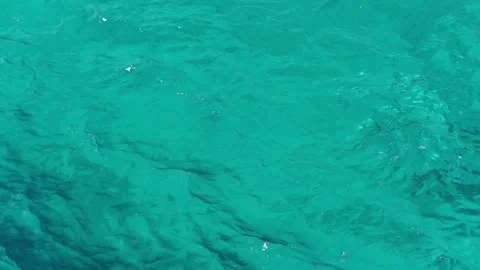 Waves moving on azure Red Sea. Blue water surface, foam bubbles. Stock Footage 292446573