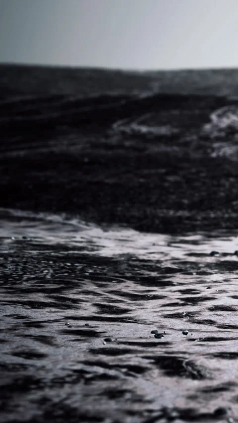 Waves moving over a dark water surface at early morning light Stock Footage 347549253