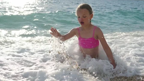 Waves moving on the surface of the ocean during sunset Stock Footage 345724990