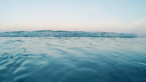 Waves in the ocean and sand beach Stock Footage 105417771