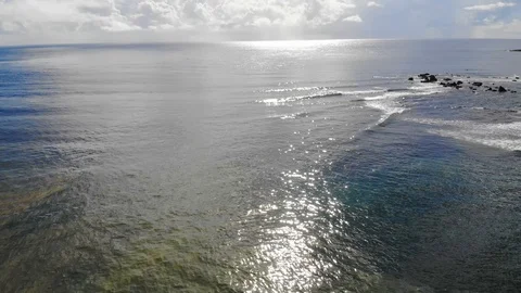 Waves on the ocean and sun shining 4K aerial. Stock Footage 107445846