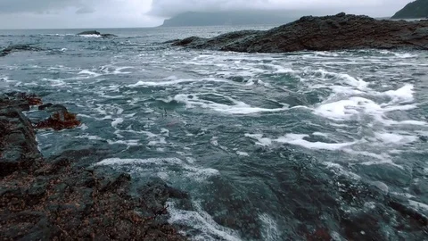 Waves of the ocean are breaking about the reefs Stock Footage 84006230