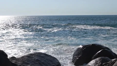 Waves of the ocean breaking on stones. Stock Footage 131402606