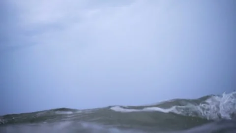 Waves on the ocean. The camera goes under water. Stock Footage 80889536