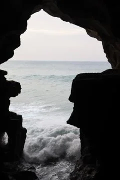 Waves from The Ocean with the Cave as the Picture Border for Framing Technique Stock Photos