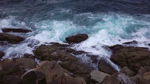 The waves of the ocean crash against the rocks. Stock Footage 196243185