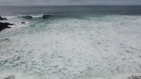Waves of the ocean. Drone shot flying from Ocean Video stock 143496575