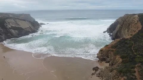 Waves of the ocean. Drone shot. Flying down Video stock 143496659