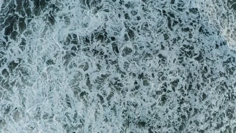 Waves in the ocean with foam view from above Stock Footage 229680759