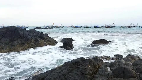 Waves of Ocean splashing on rocks and stones at a beach Coast Vídeo Stock 342698107