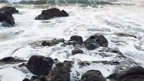 Waves of Ocean splashing on rocks and stones at a beach Coast Vidéo 342698110