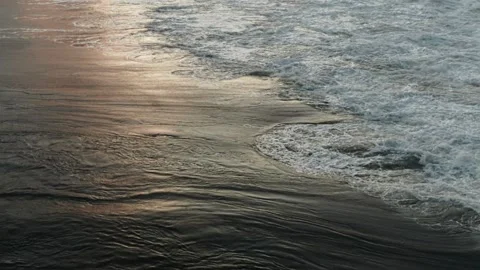 Waves in the ocean at sunset, view from above Stock Footage 229680659