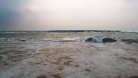 Waves of the ocean touch the feet Stock Footage 170079090