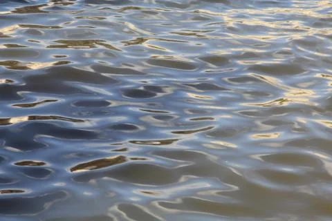 Waves of one river of completely different colors Stock Photos