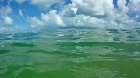 Waves in open sea and blue sky with clouds Stock Footage 10823487