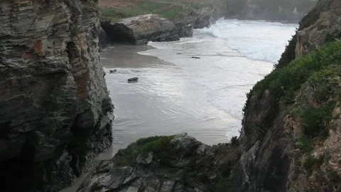 Waves in Os Castros beach, Ribadeo, Spain in a winter evening Stock Footage 303671095
