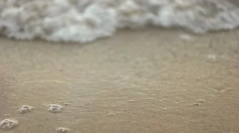 Waves out on the sand Stock Footage 65292930