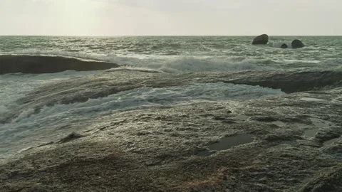 Waves over big rocks Stock Footage 331062559
