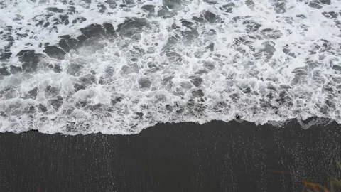 Waves over black sand Stock Footage 90638258
