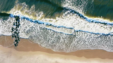 Waves Over Jetty Top Down Stock Footage 154649488