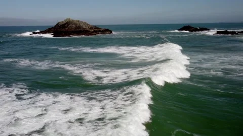 Waves over the sea in Cornwall viewed from a drone following the wave Stock-Footage 262443184
