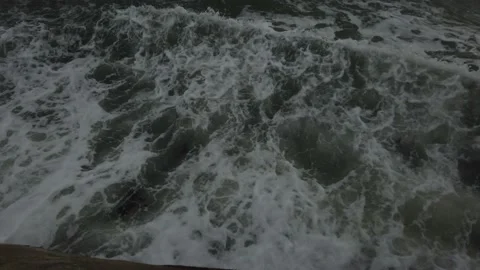 Waves over a sea wall Stock Footage 138220061