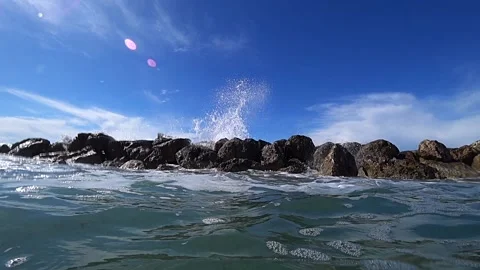 Waves over wavebreaker, slow motion Stock Footage 185867521