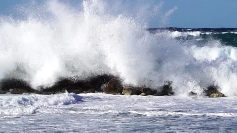 Waves over wavebreaker with strong wind, slow mo Stock Footage 185864355