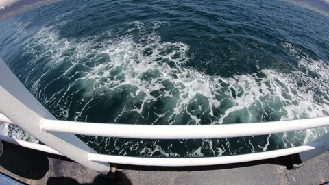 Waves of a passing ferry Stock Footage 277541045